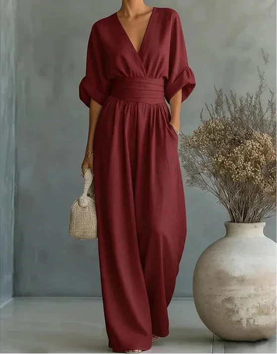 Mono casual elegante de mujer, escote V profundo y pantalón ancho. Perfecto para un look fluido.
