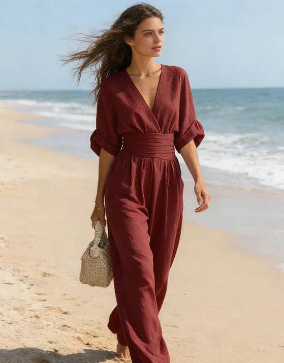 Mono de mujer elegante, escote V y pantalón ancho fluido. Ideal para verano y ocasiones especiales.