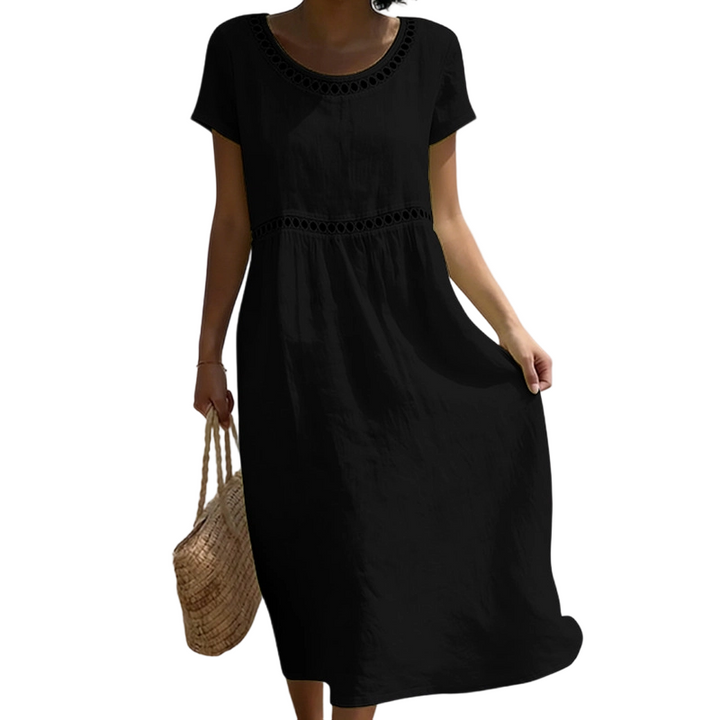 Mujer luciendo vestido midi casual de verano, tela ligera y fresca para máximo confort.