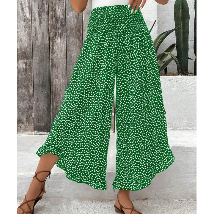 Pantalones de mujer fluidos con pierna ancha y cintura alta, perfectos para looks casuales y elegantes.