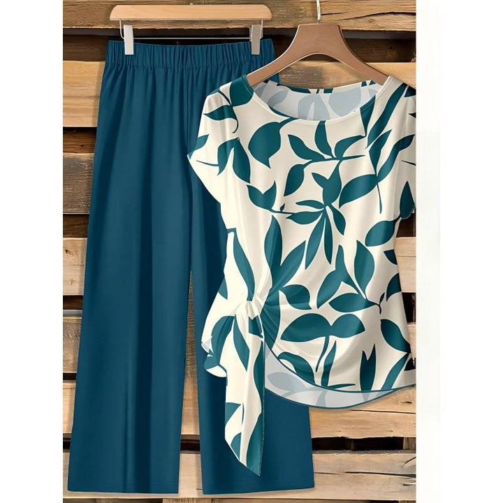 Set de moda femenina: top con patrón abstracto y pantalón ancho, ideal para un estilo cómodo y sofisticado.