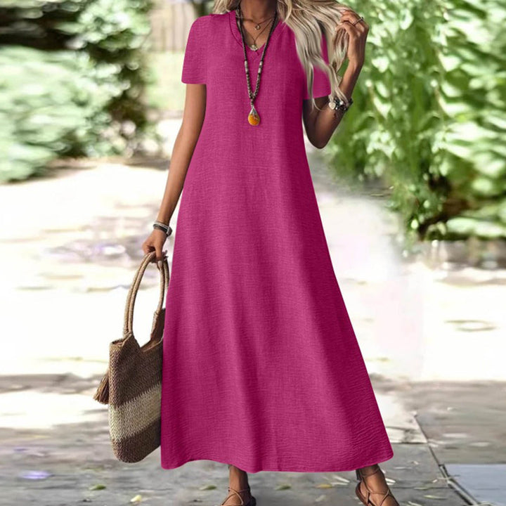 Vestido maxi cuello V con bolsillos, moda femenina para vacaciones y relax.