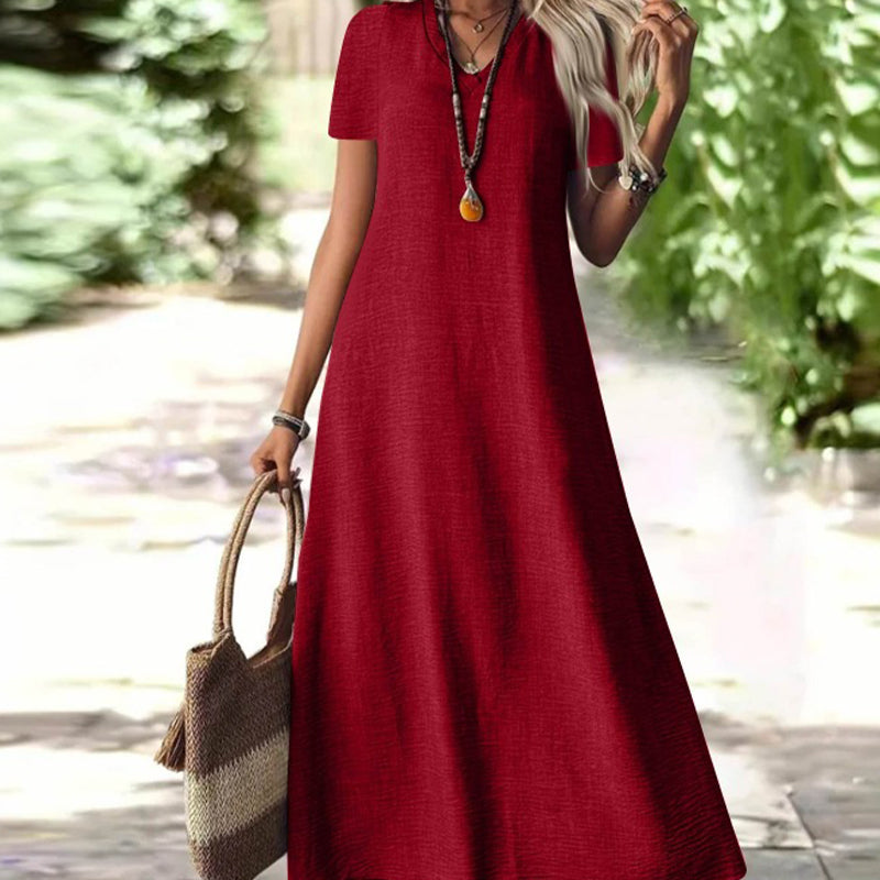 Vestido maxi versátil, mujer, cuello V, bolsillos discretos, estilo cómodo y chic.