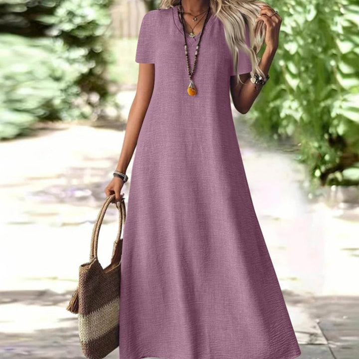 Vestido largo mujer, fluido, cuello V, bolsillos, para un estilo cómodo y moderno.