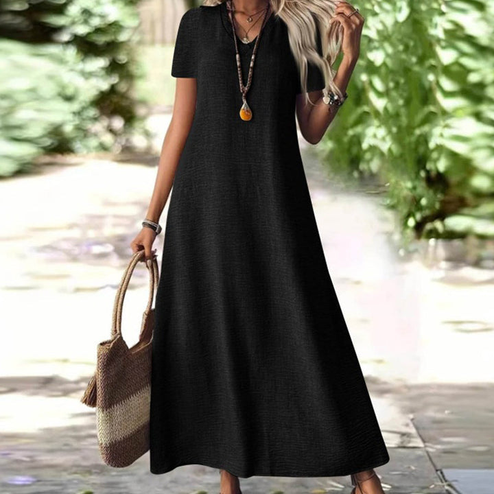 Elegante vestido largo mujer, estilo fluido, cuello V, con prácticos bolsillos.