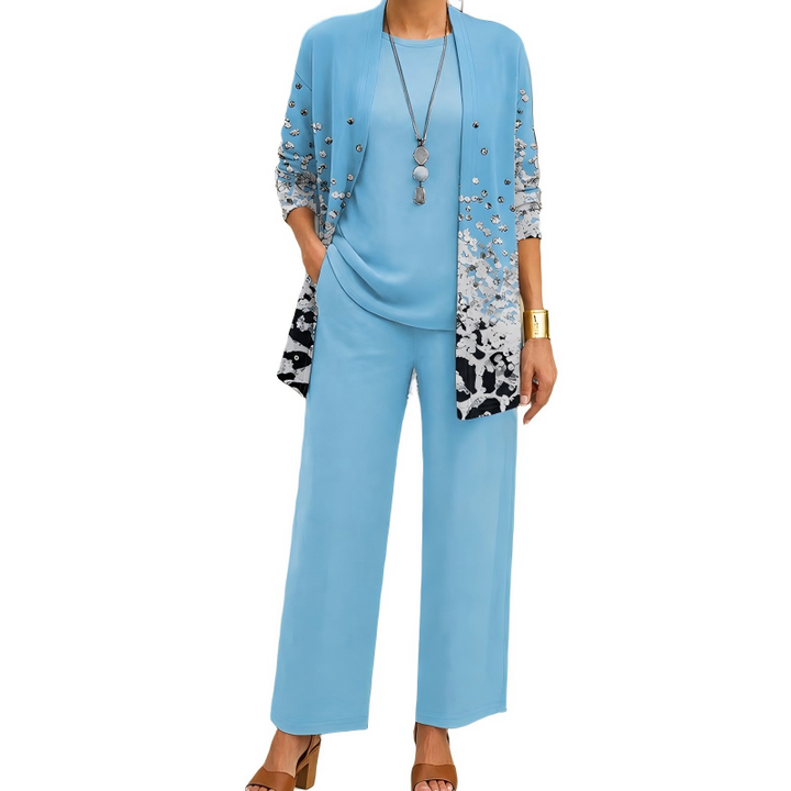Conjunto elegante de tres piezas para mujer: cárdigan estampado, blusa suave y pantalón fluido. Perfecta ropa chic.