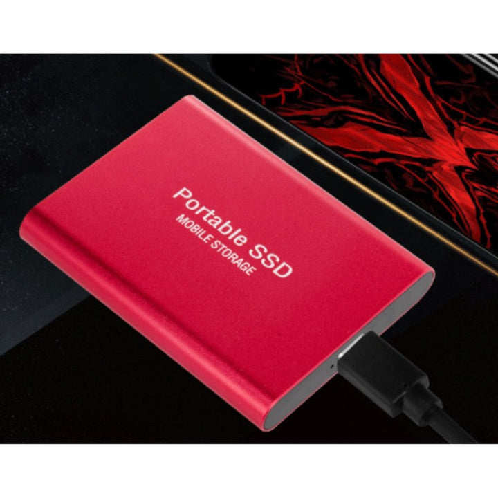 Moderno SSD portátil USB-C de 2 TB; solución compacta de almacenamiento externo para datos y multimedia.