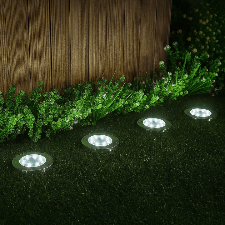 Detalle de luz solar LED de jardín, mostrando su panel solar integrado y diseño de acero inoxidable para exterior.