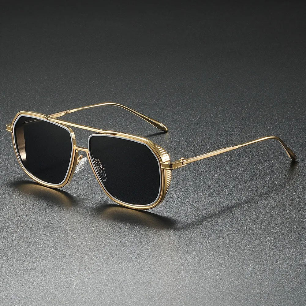 Gafas de sol aviador unisex con lentes degradados marrones y montura metálica dorada. Estilo clásico y protección UV.