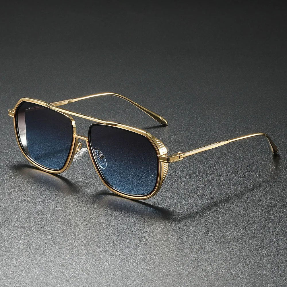 Elegantes gafas de sol aviador unisex con lentes degradados y montura metálica plateada. Máxima protección UV.