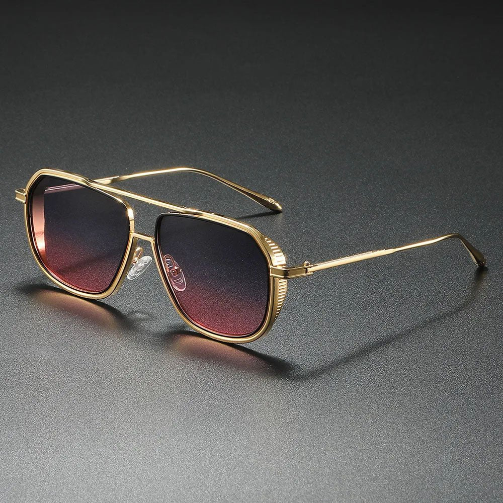 Gafas de sol aviador clásicas con montura metálica negra y lentes degradados grises. Diseño unisex versátil.
