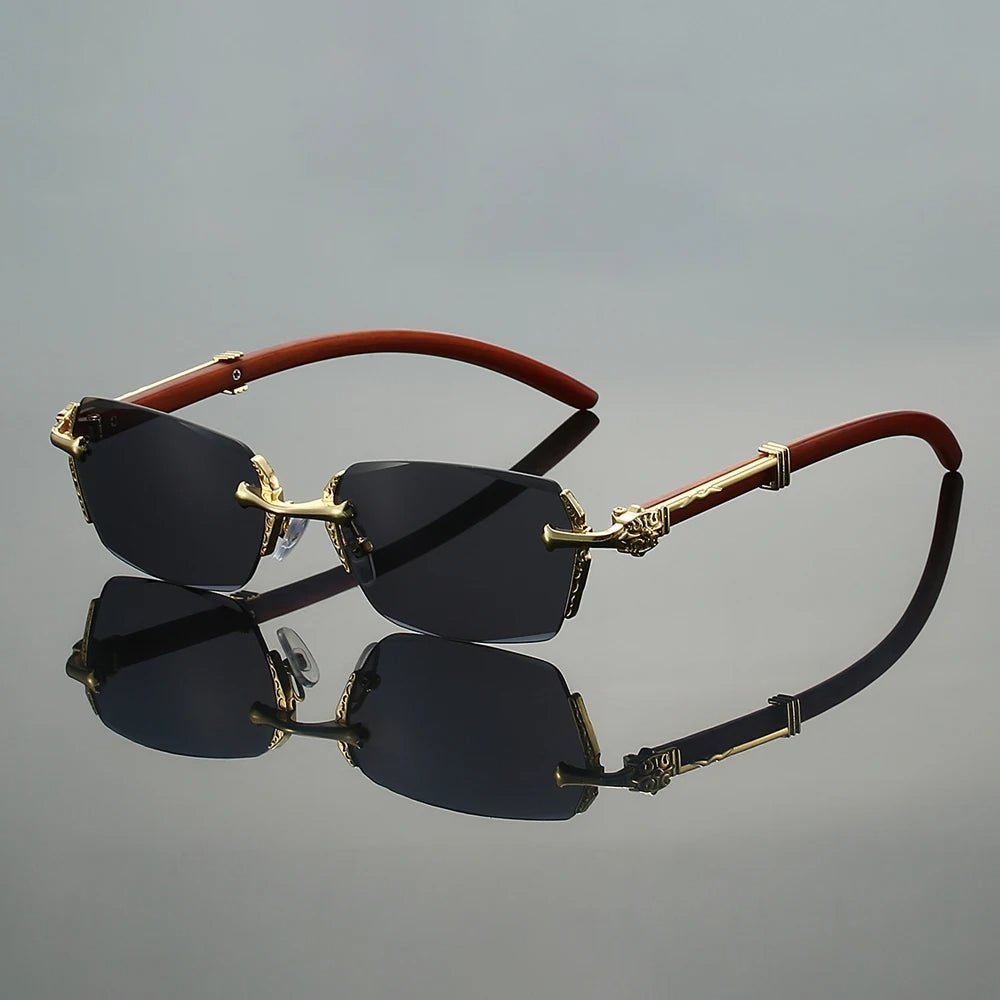 Gafas de sol unisex sin montura con protección UV400 y varillas doradas. Estilo moderno y elegante.
