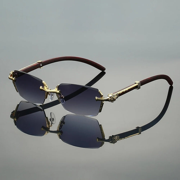 Gafas de sol ligeras unisex sin montura. Diseño moderno con varillas doradas y protección UV400.