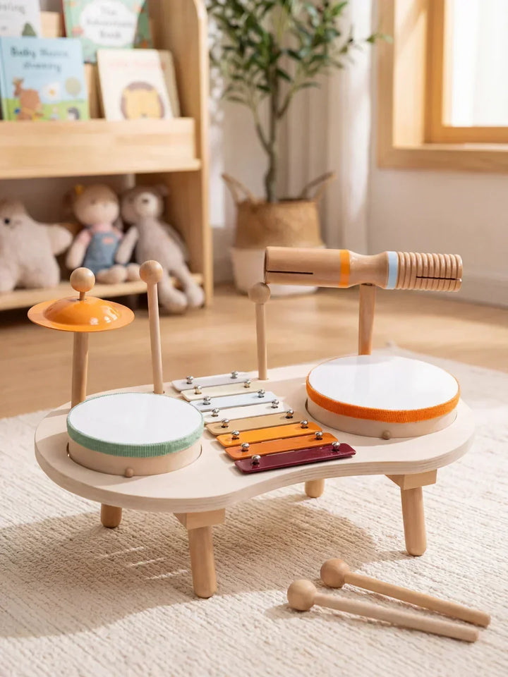 Juguete musical de madera ecológico para niños. Mesa con 5 instrumentos integrados, ideal para desarrollo del ritmo y la creatividad.