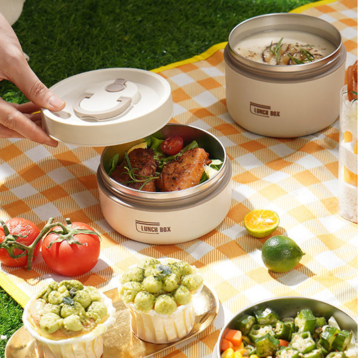 Contenedor térmico multicapa con compartimentos, para almuerzos saludables en el trabajo.
