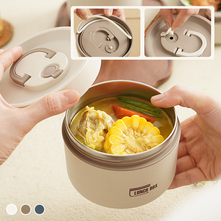Fiambrera de acero inoxidable, aislada, tipo bento, ideal para comidas frescas y organizadas.
