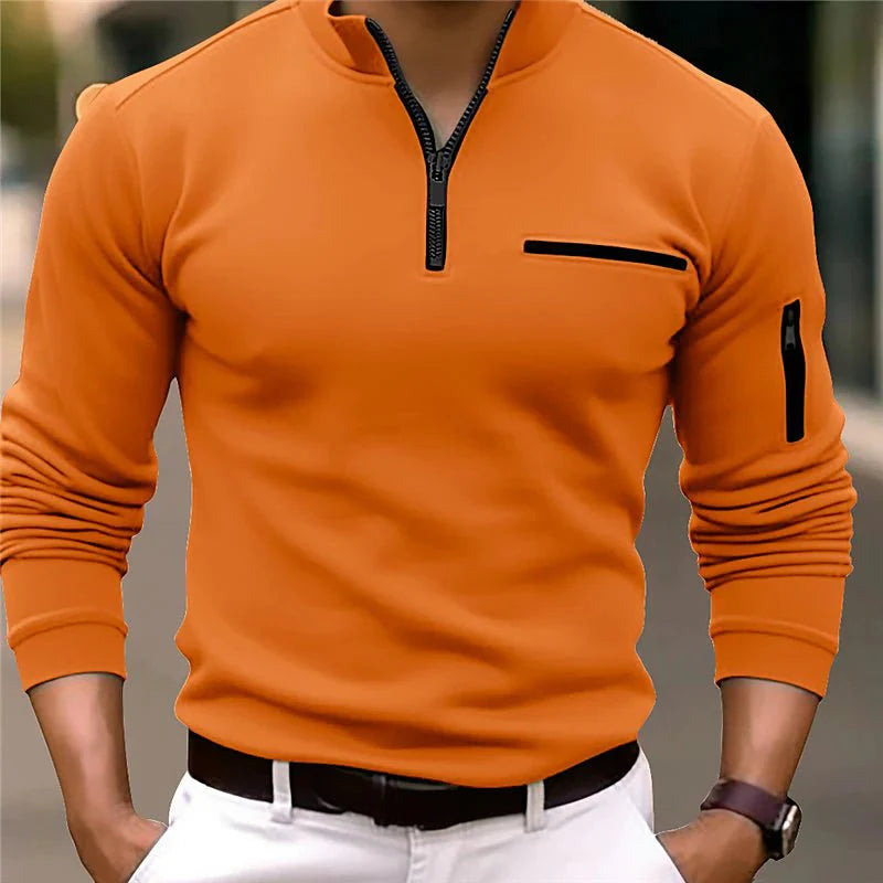 Suéter moderno para hombre con cremallera y bolsillo en el pecho. Manga larga, ideal para un look casual.