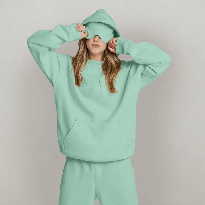 Sudadera de viaje para mujer con capucha y máscara integrada. Máximo confort en tus aventuras.