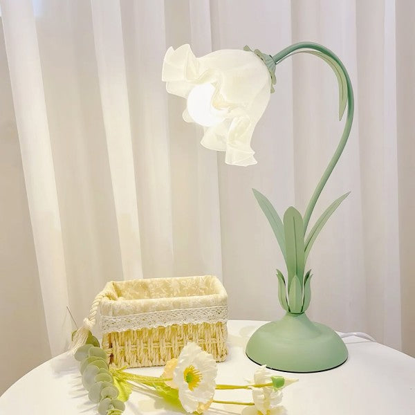 Lámpara de mesa rosa floral, estilo retro y brazo ajustable para tu salón.