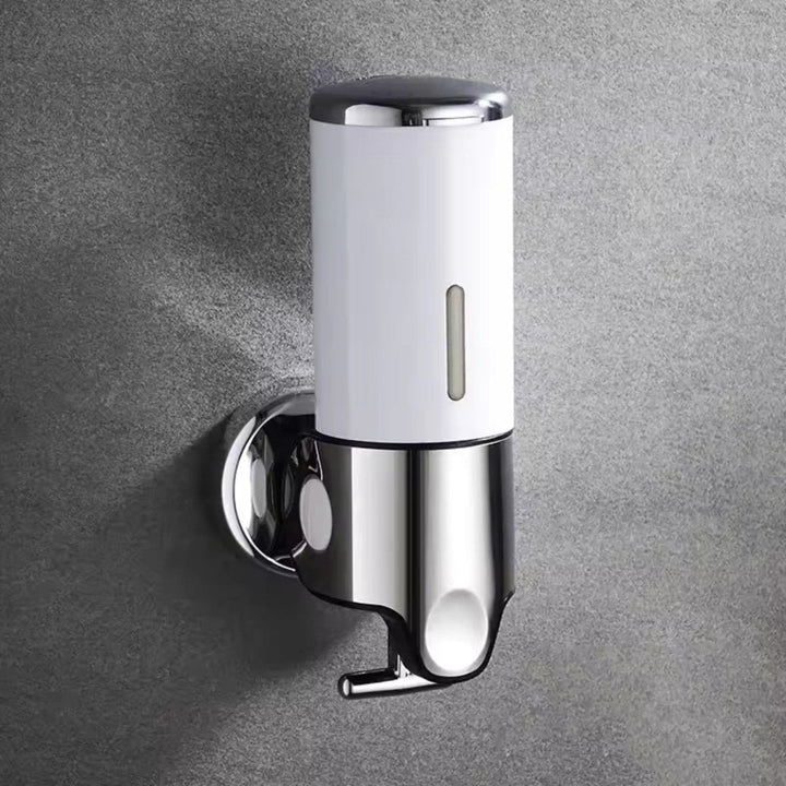 Moderno dispensador de jabón en acero inoxidable, ideal para pared en hogar u oficina.