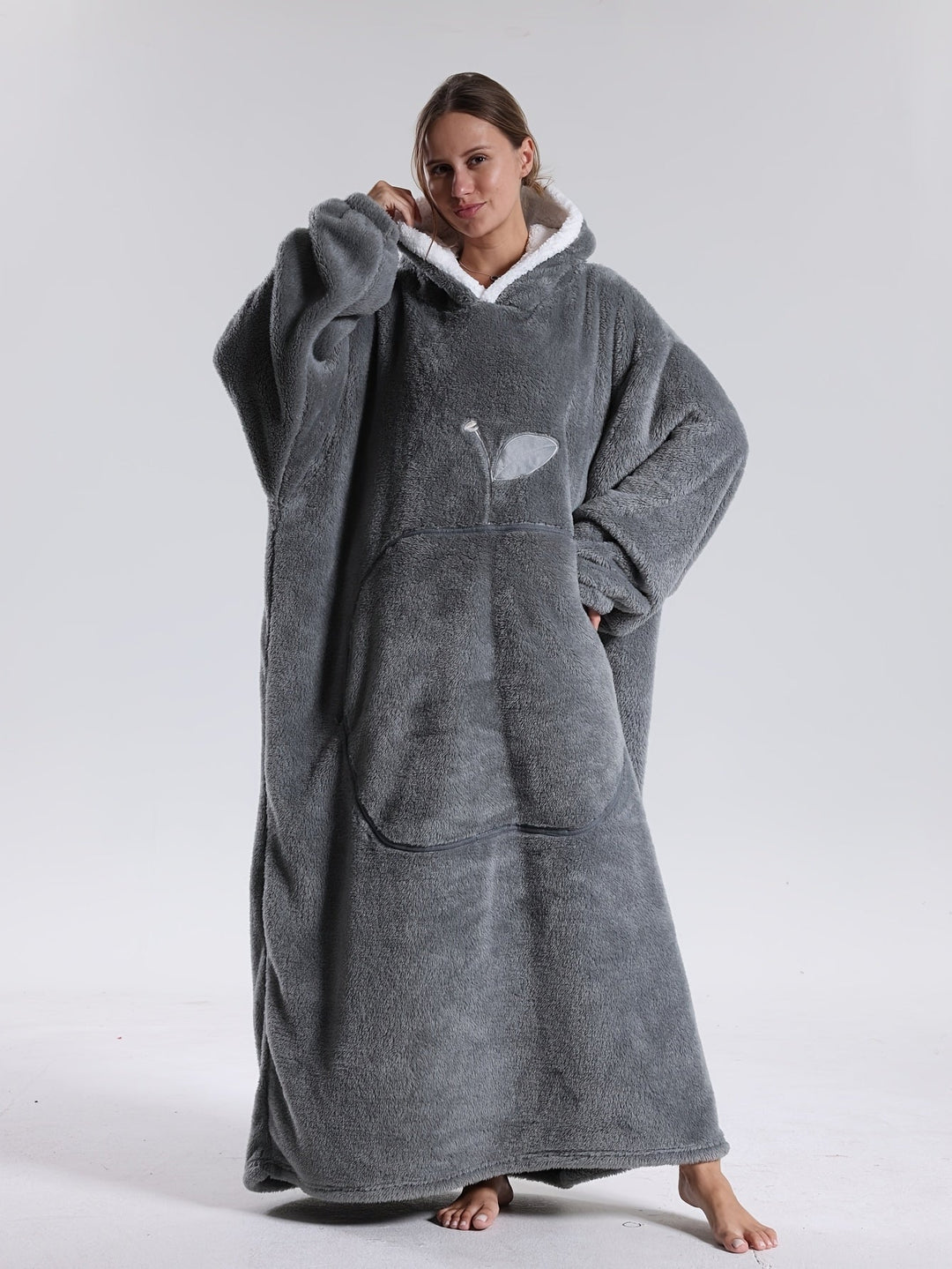 Práctica manta sudadera unisex con gran bolsillo frontal, perfecta para manos frías o móvil.