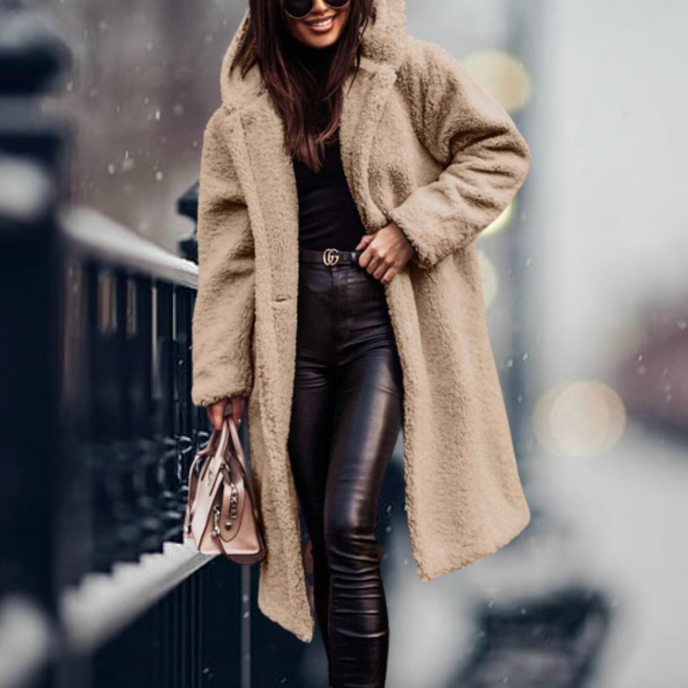 Modelo posando con abrigo de invierno elegante, cálido y de moda para mujer, estilo invernal. [[lstfy-media:11]]