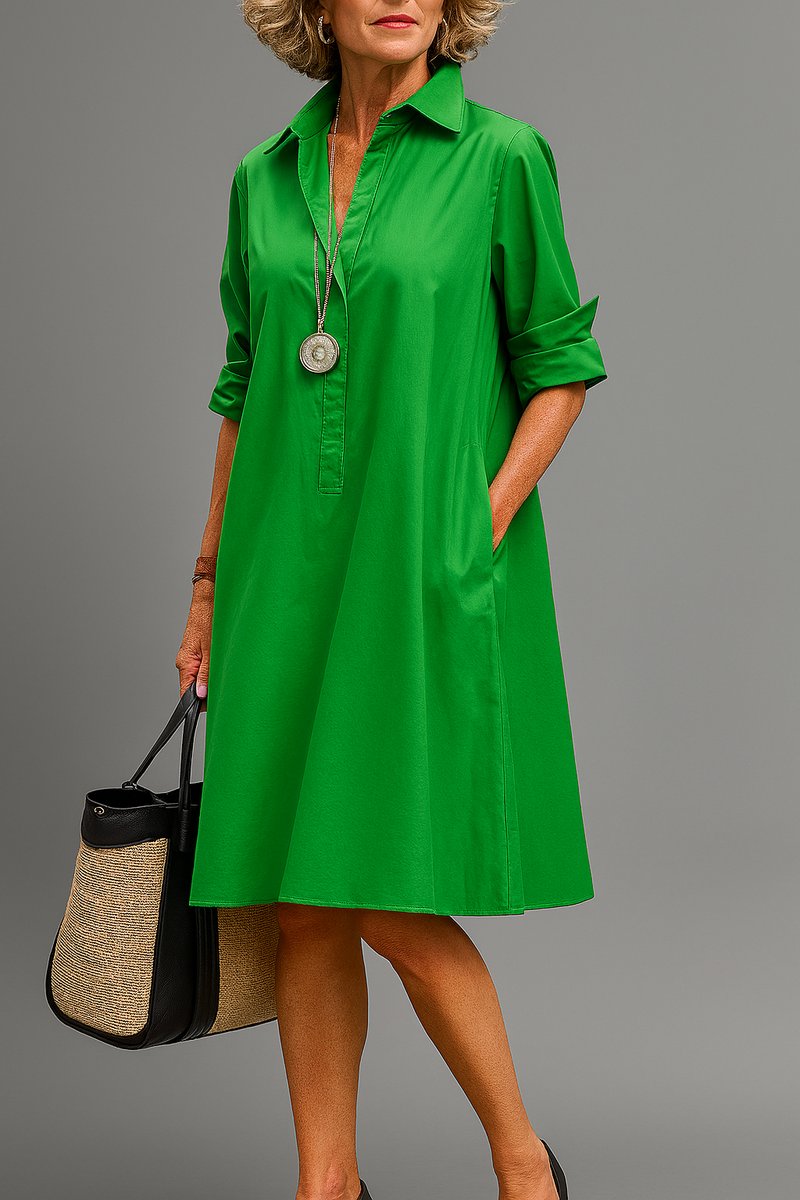 Vestido midi evasé verde para mujer con cuello V, mangas 3/4 y bolsillos. Diseño elegante y casual perfecto.
