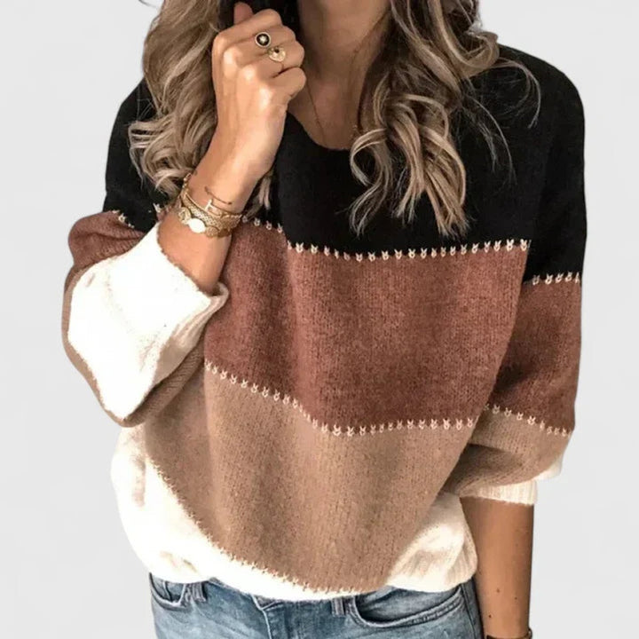 Jersey de punto para mujer con diseño de rayas y bloques de color. Ideal para invierno casual.