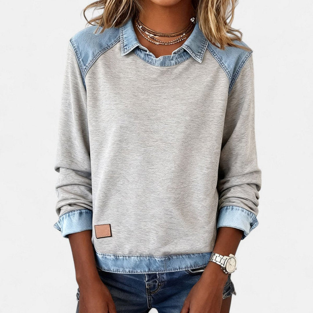Suéter femenino Isabella con cuello contrastante y manga larga, estilo moderno y actual.