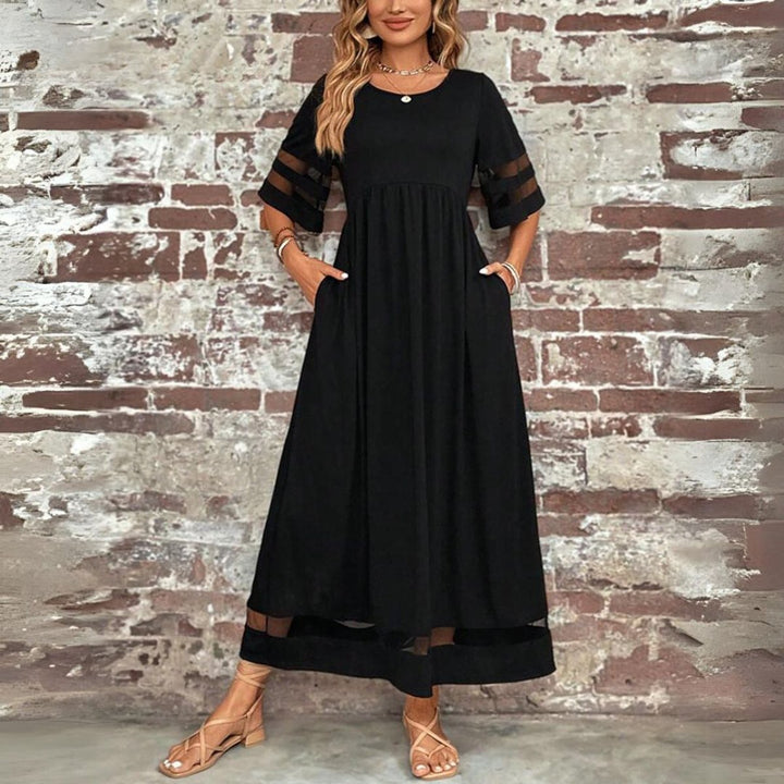 Vestido midi elegante para mujer con cintura imperio y falda de tul. Perfecto para fiesta o evento especial.