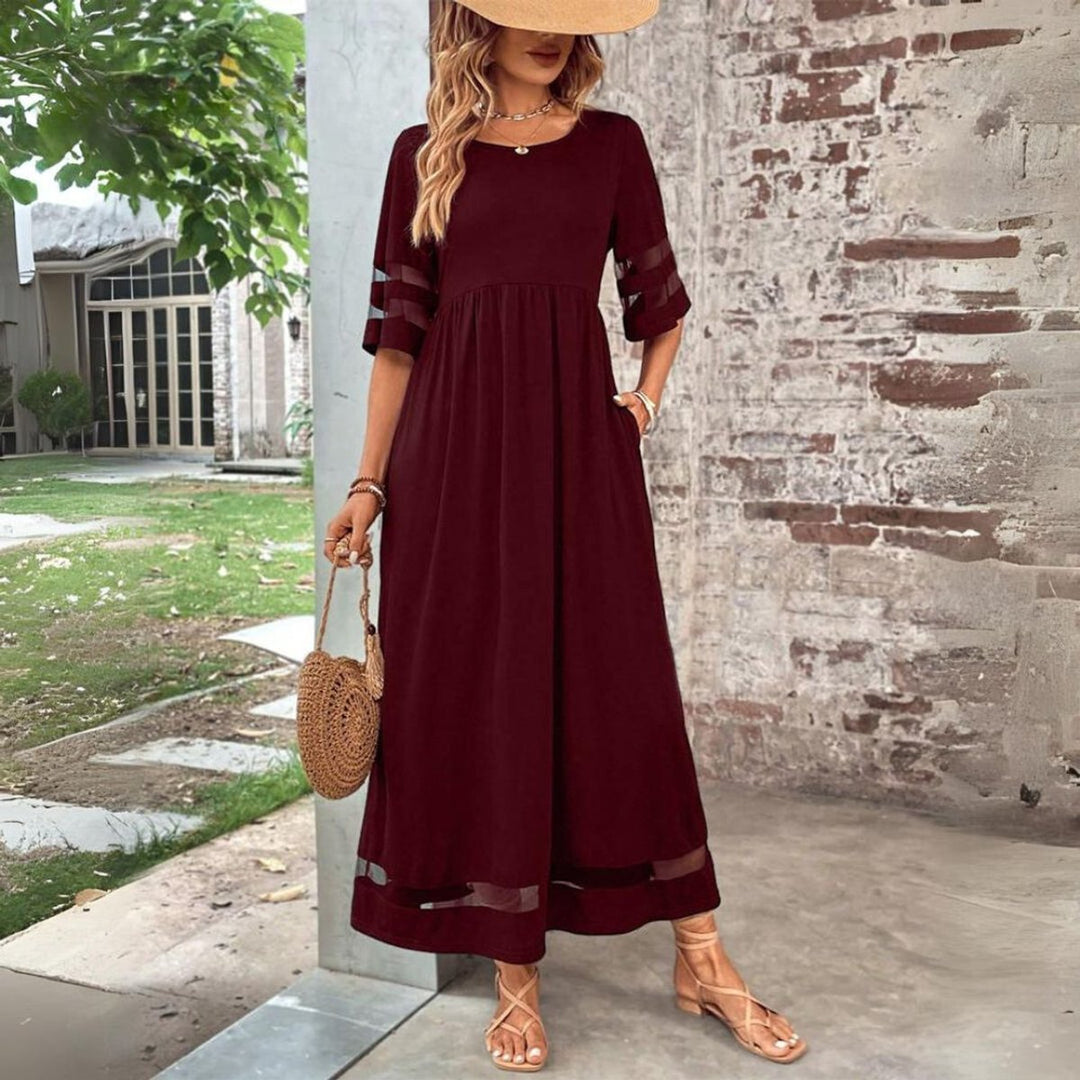 Vestido midi de mujer, diseño elegante con tul y cintura imperio. Ideal para ocasiones de fiesta o moda casual.