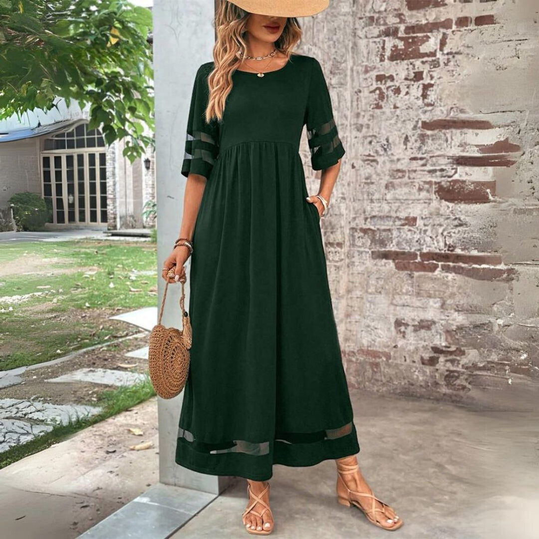 Vestido midi de mujer con diseño de cintura imperio y detalles de tul. Estilo evase, ideal para moda y eventos.