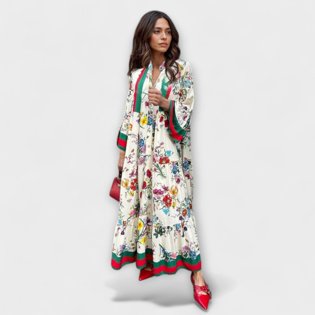 Vestido maxi fluido de mujer con estampado abstracto, escote en V y mangas murciélago. Ideal para verano elegante.