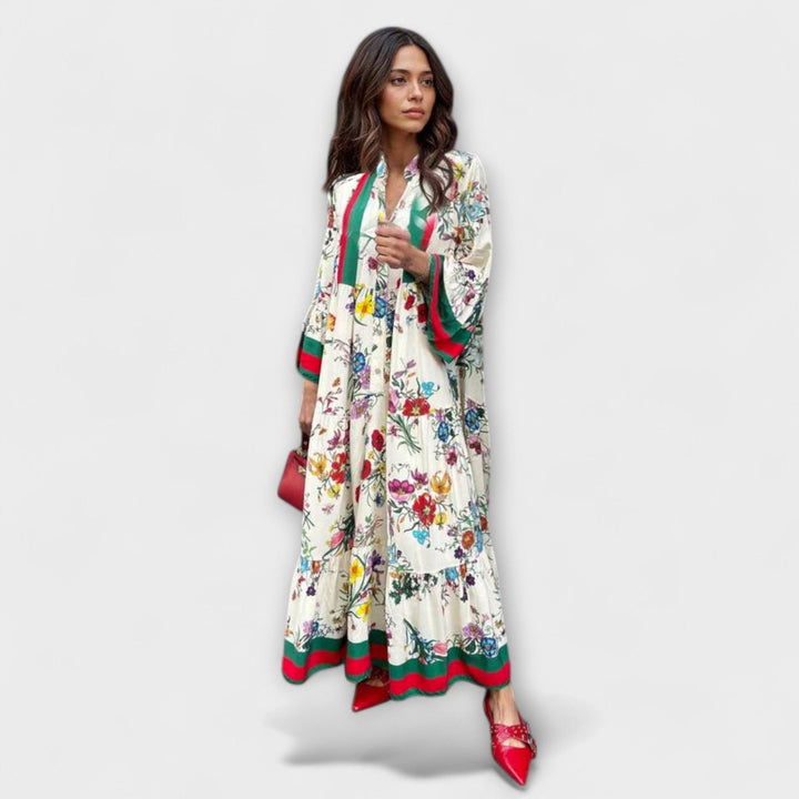 Vestido maxi fluido de mujer con estampado abstracto, escote en V y mangas murciélago. Ideal para verano elegante.