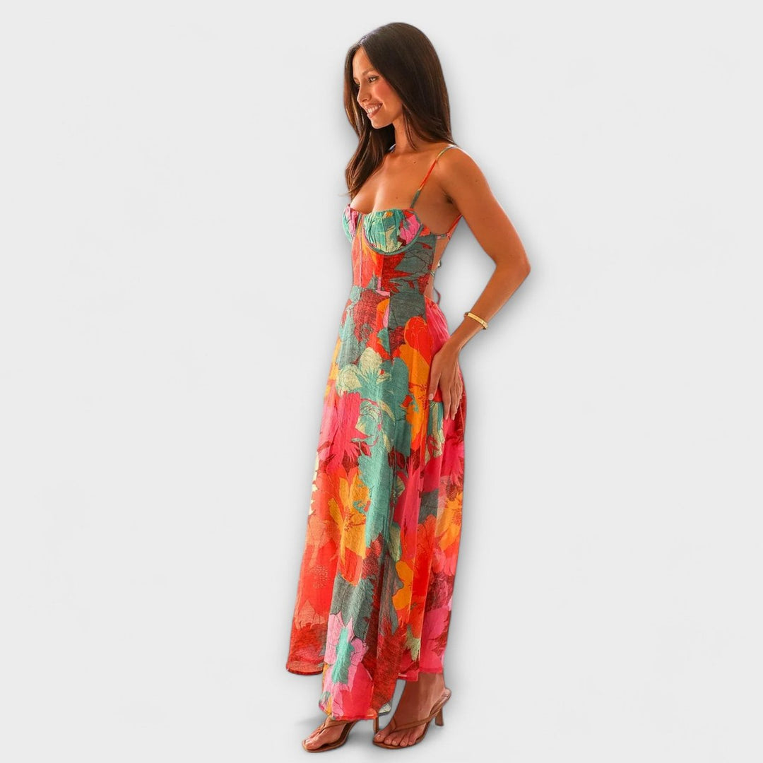 Vestido maxi floral de mujer, estampado tropical vibrante. Escote cuadrado, perfecto para un look casual de verano.