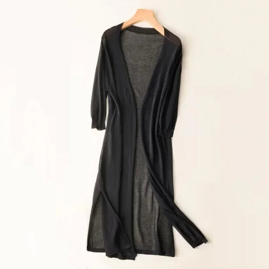 Versátil cárdigan de mujer, punto ligero y largo. Prenda esencial para un entretiempo elegante.