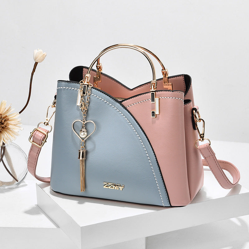 Bolso elegante y versátil, estilo bicolor para mujer. De imitación cuero, perfecto como bolso cruzado.