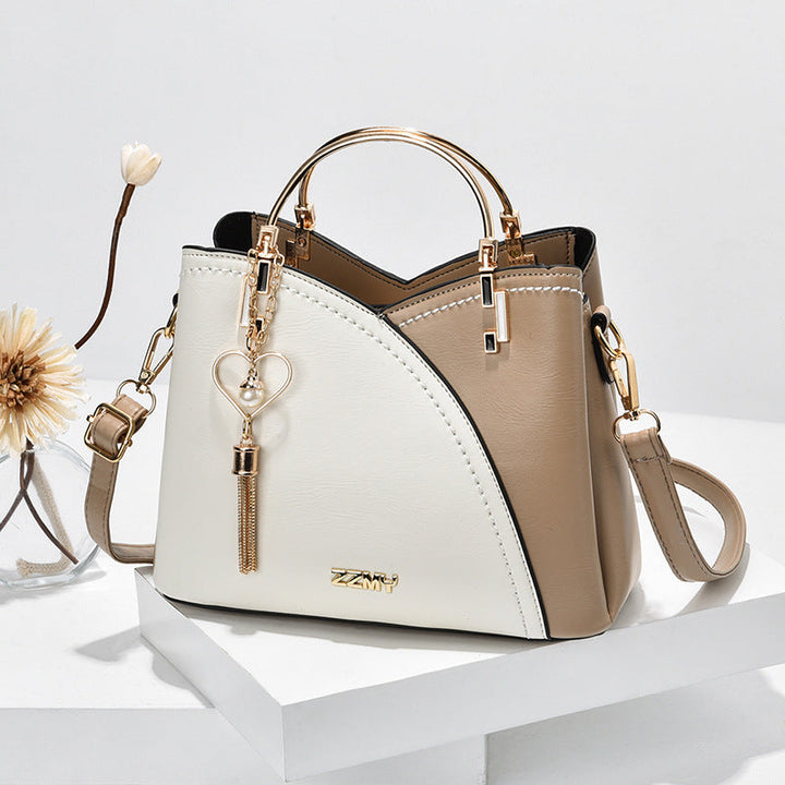 Bolso de mano elegante para mujer en imitación cuero. Ideal para oficina y uso diario.