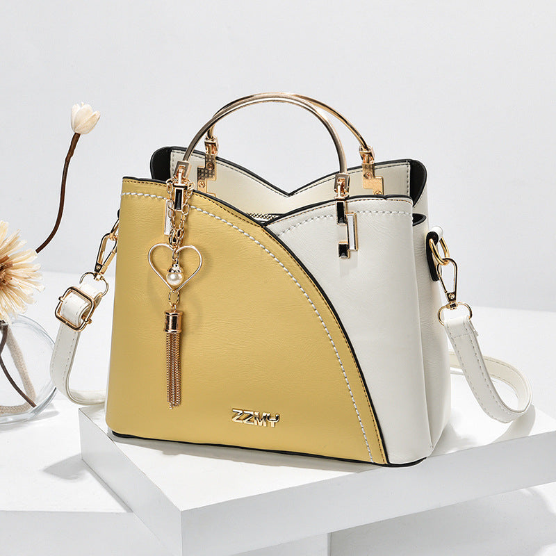 Bolso de mujer sofisticado, imitación cuero. Ideal para oficina y diario. Lujo accesible y moda.