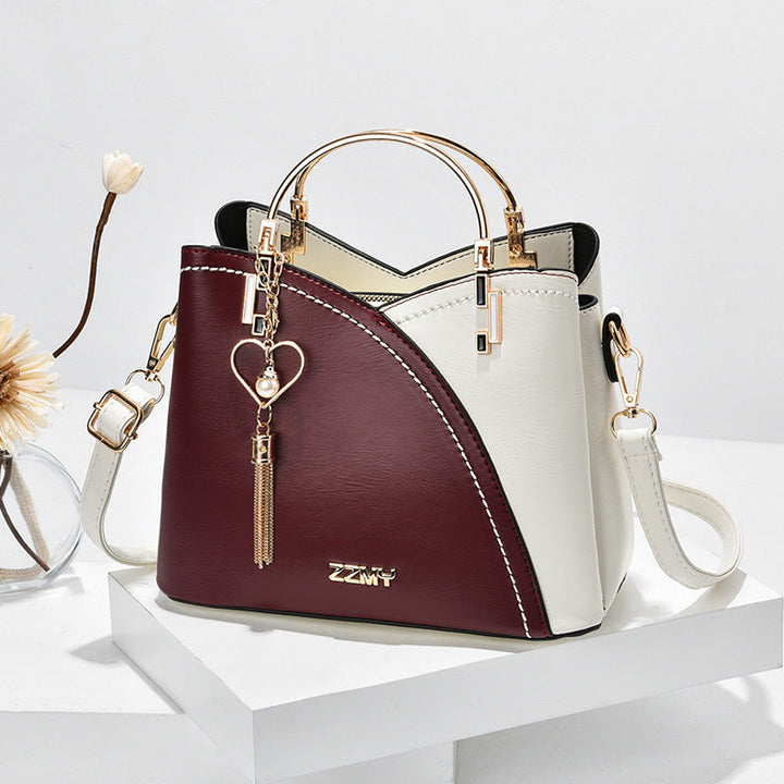 Bolso de mano chic en imitación cuero. Diseño moderno para la mujer que busca elegancia y versatilidad.